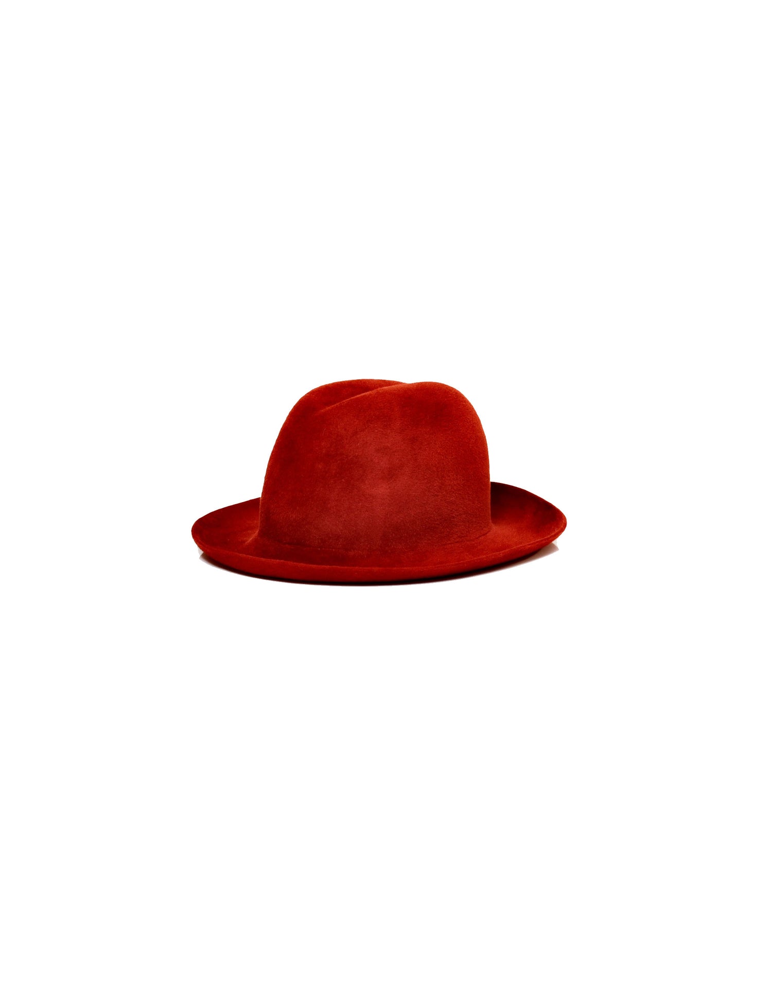 A red curvy wool hat with a curved brim and an asymmetric center-dent crown.