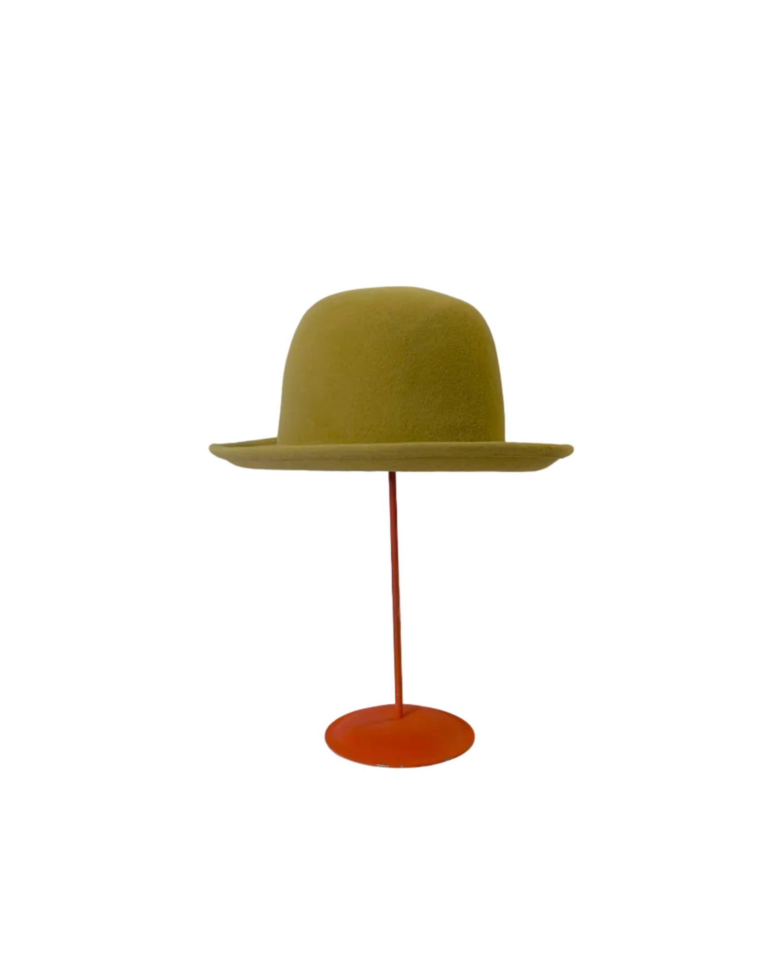 Yellow Bowler hat on a red stand against a white background