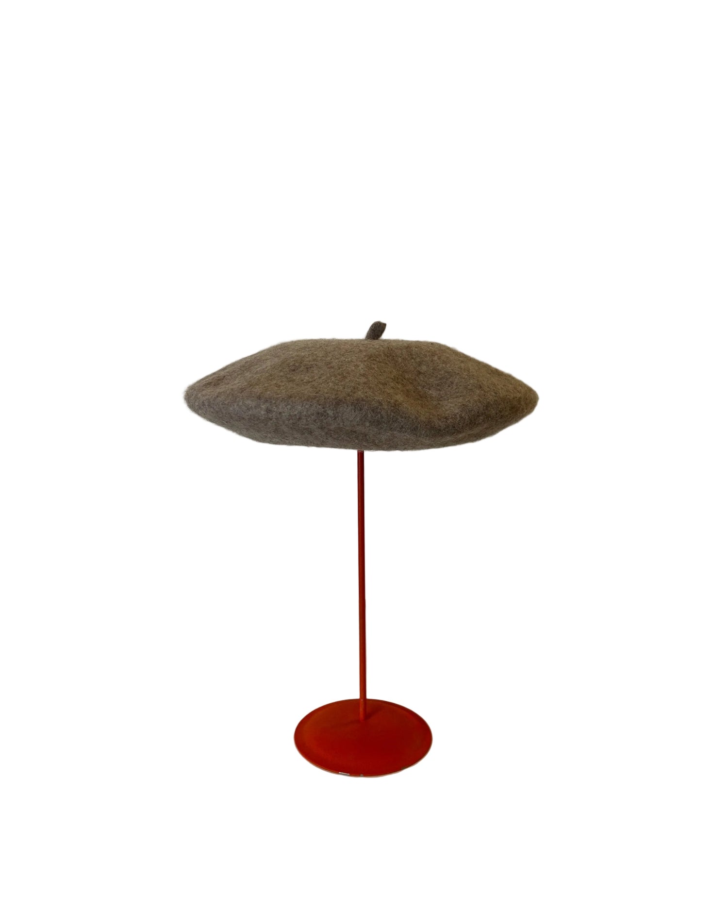 Taupe Beret on a red stand against a white background