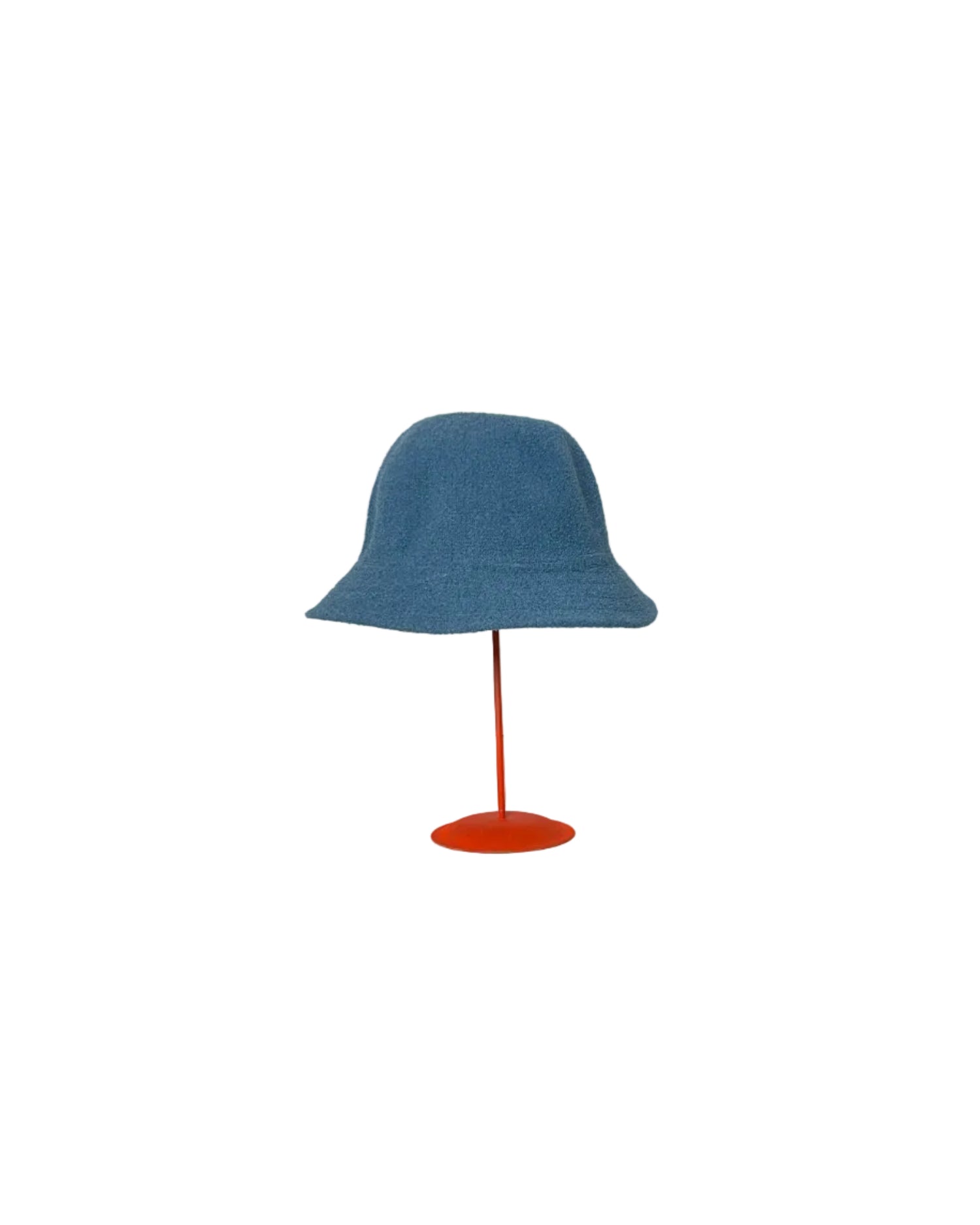 Blue Bucket hat on a red stand against a white backdrop.