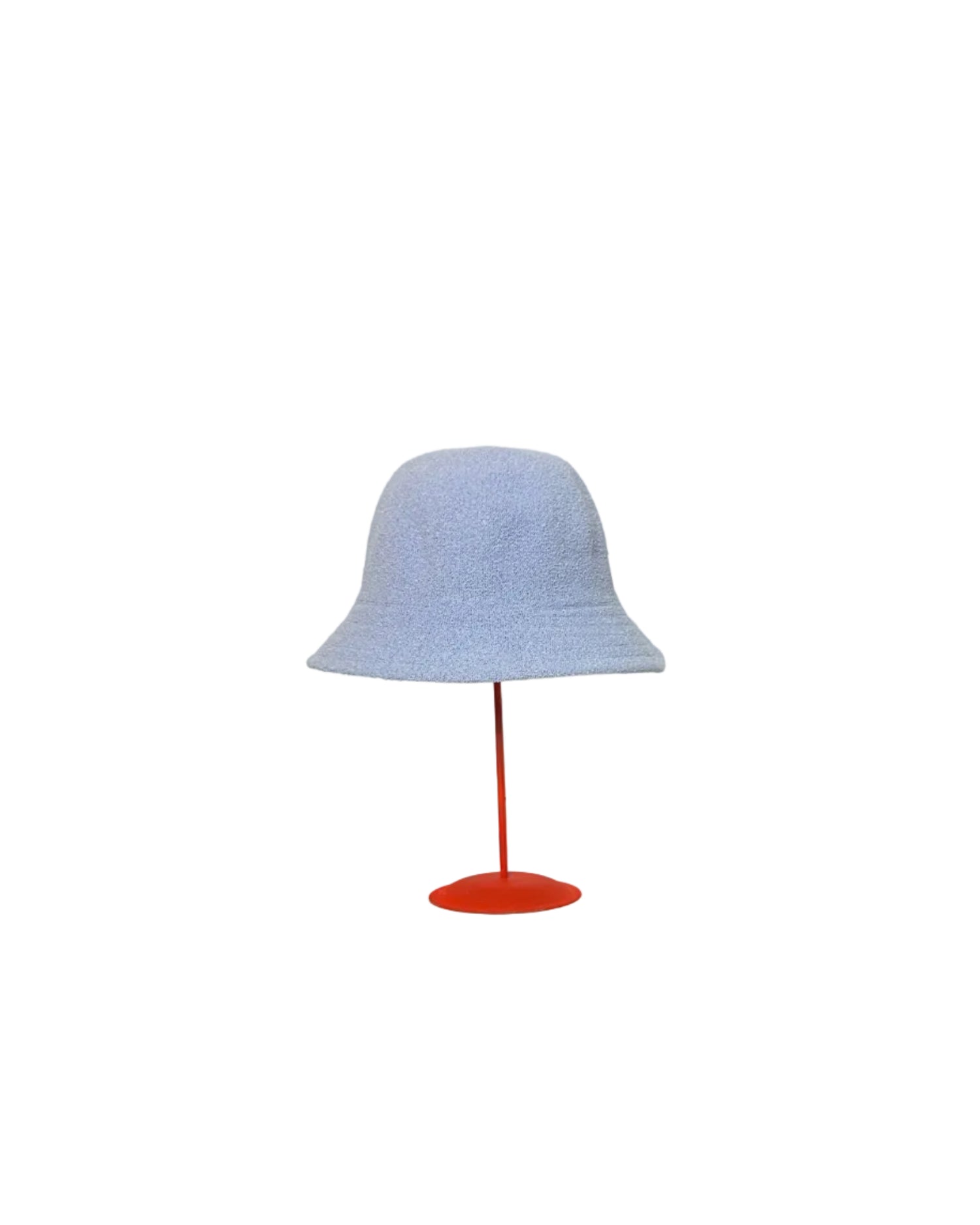 Baby Blue Bucket hat on a red stand against a white backdrop.
