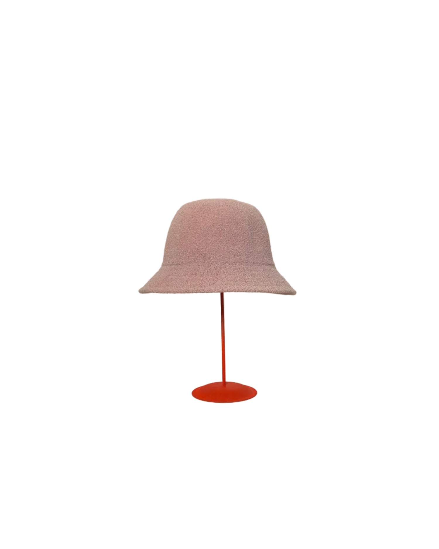 Pink Bucket hat on a red stand against a white backdrop.
