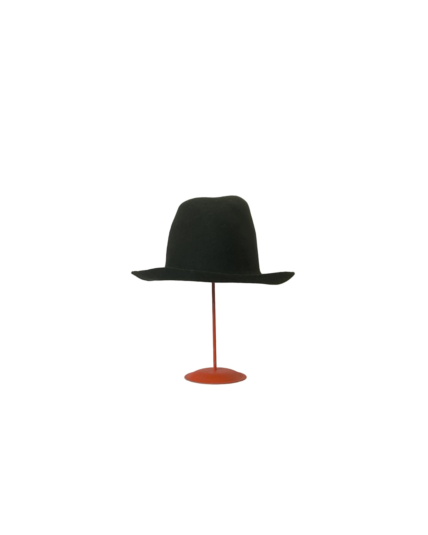 Dark green fedora hat on a red stand against a white backdrop