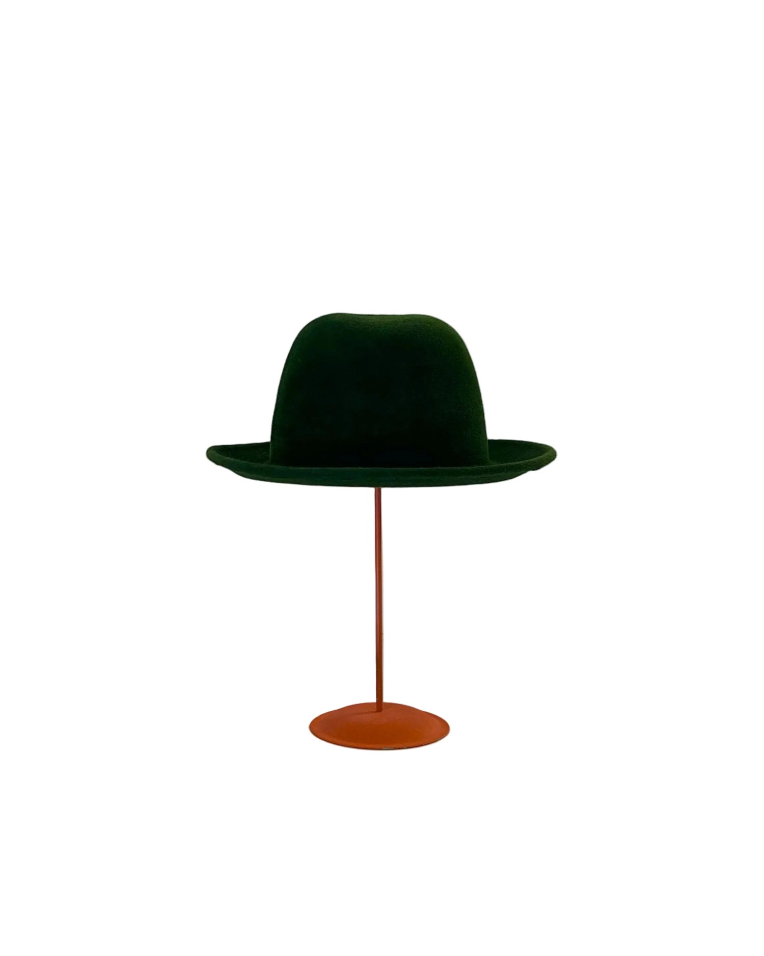 Green Bowler hat on a red stand against a white background