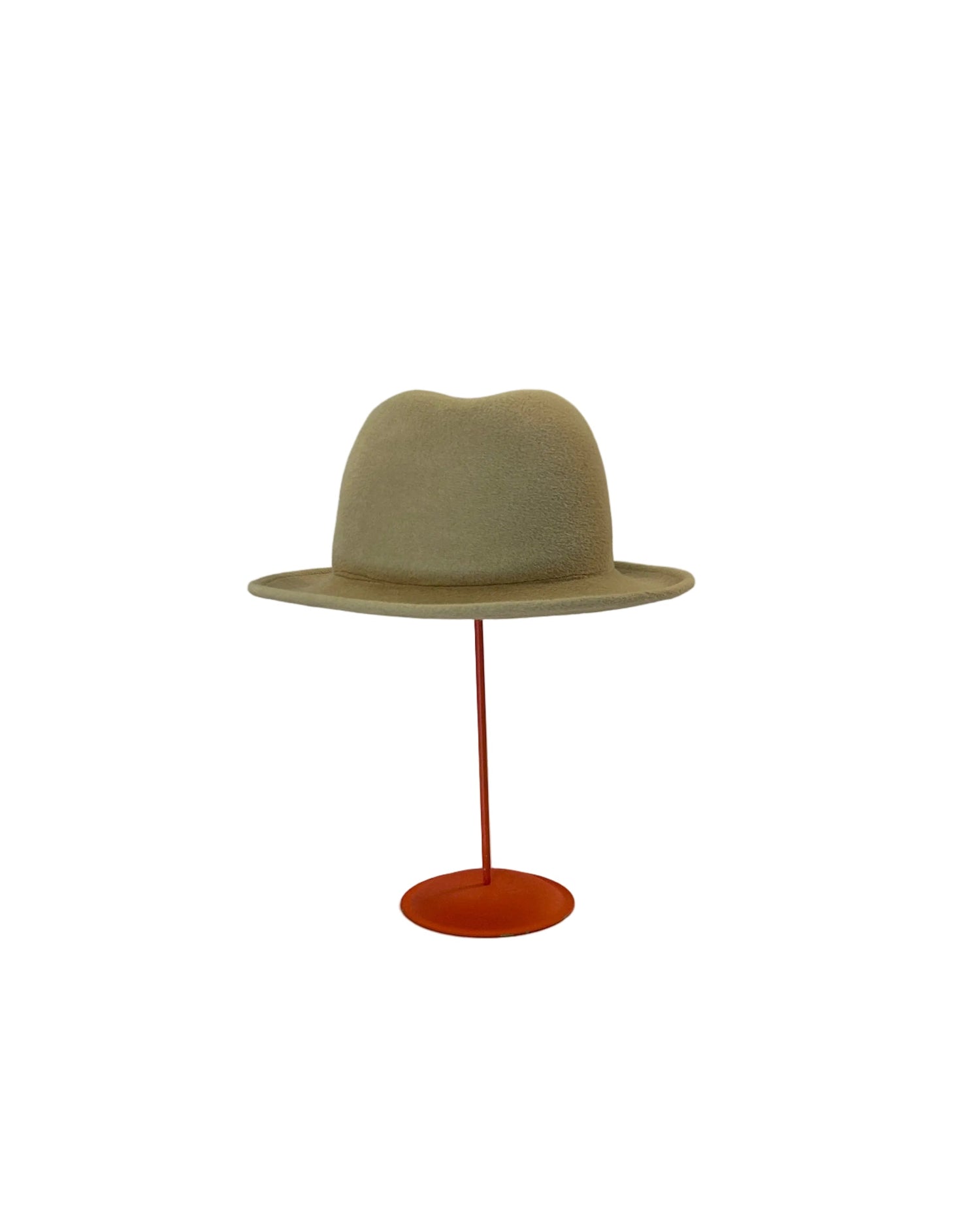 Beige Bowler hat on a red stand against a white background