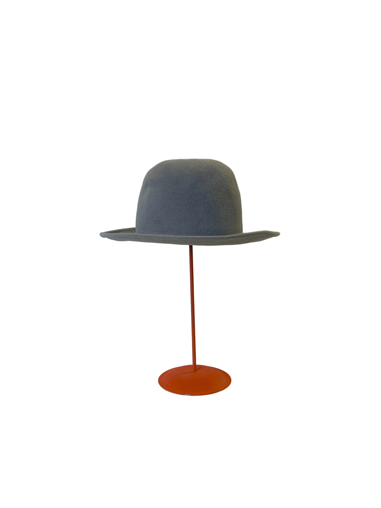 Gray Bowler hat on a red stand against a white background