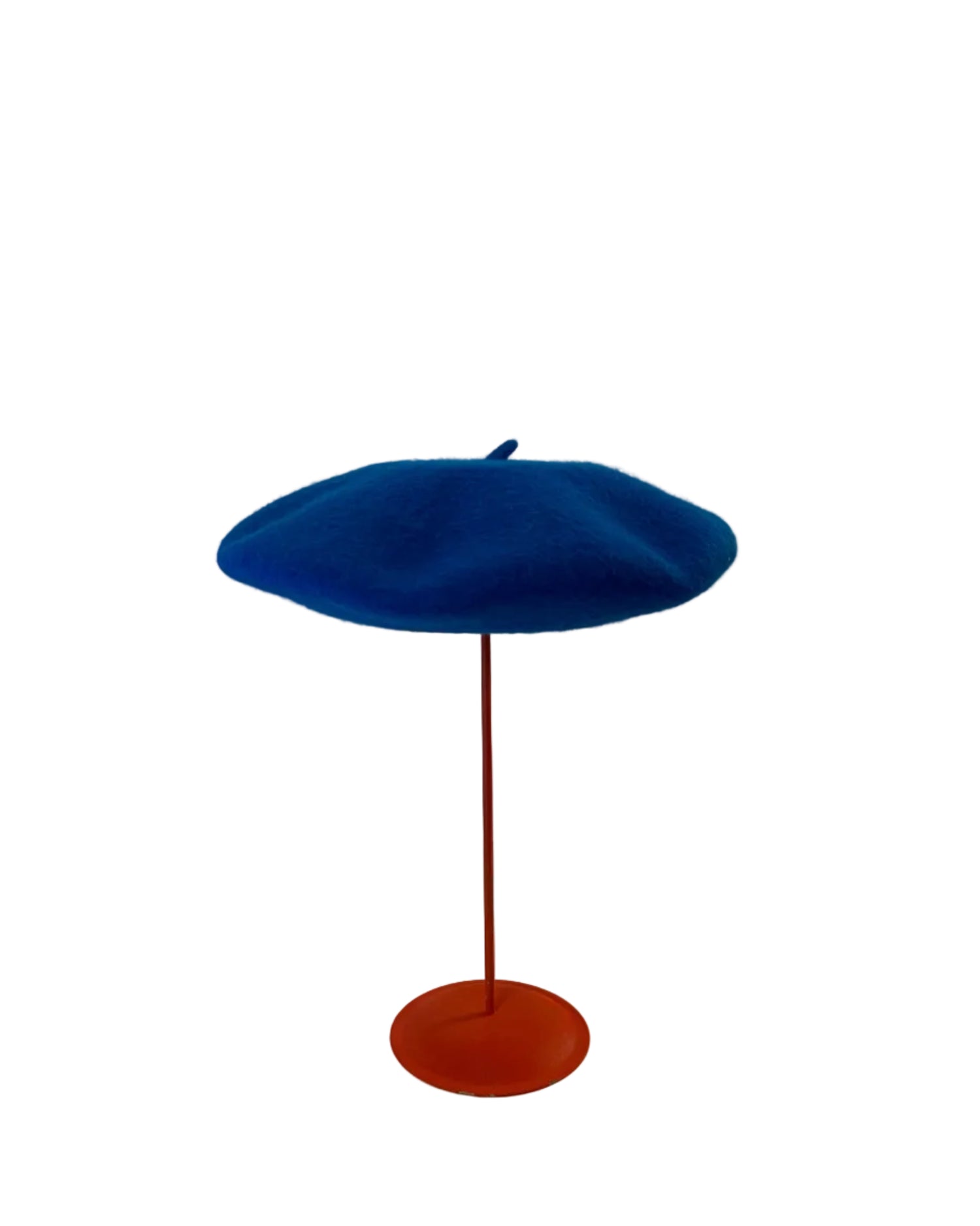Blue Beret on a red stand against a white background