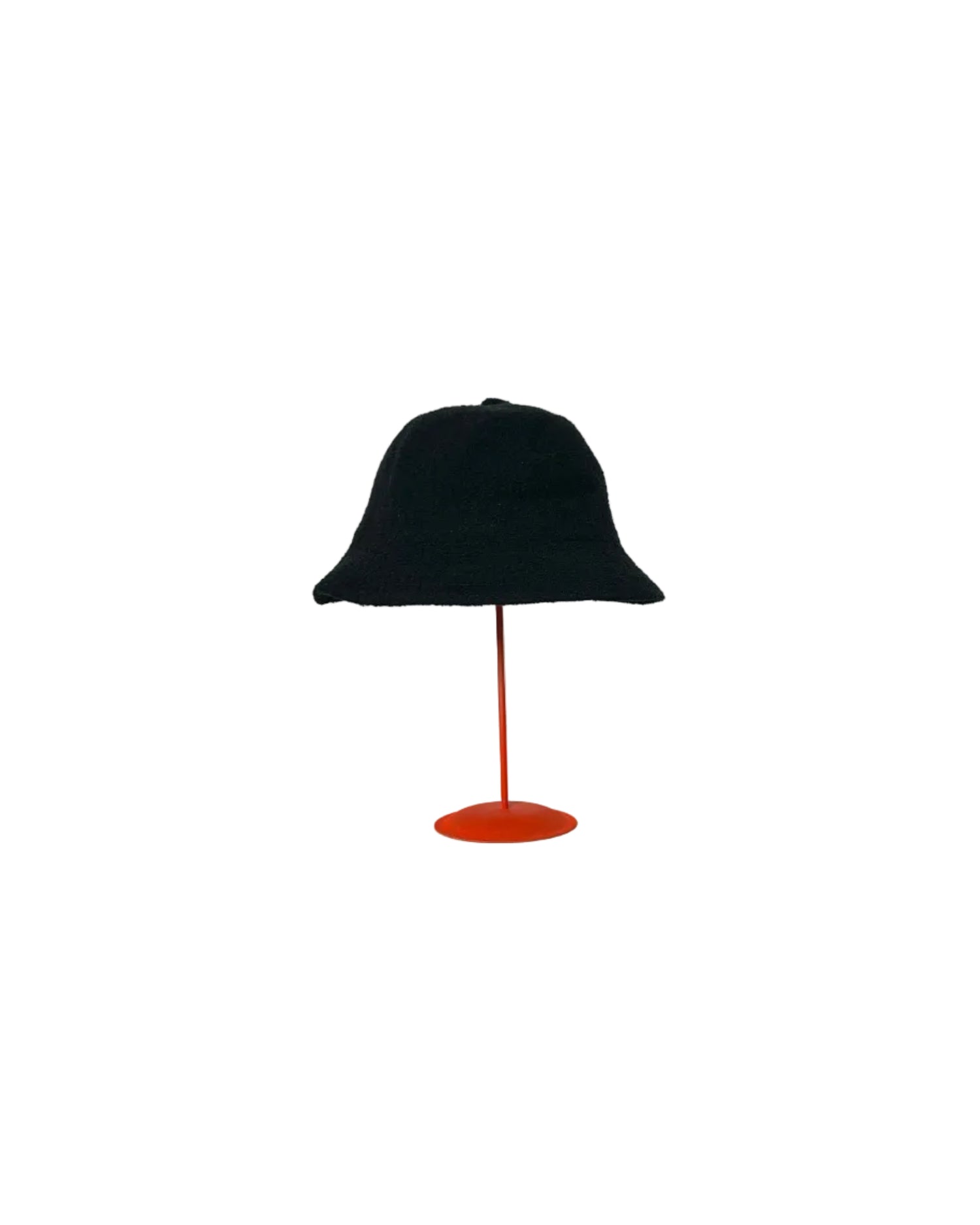 Black Bucket hat on a red stand against a white backdrop. 