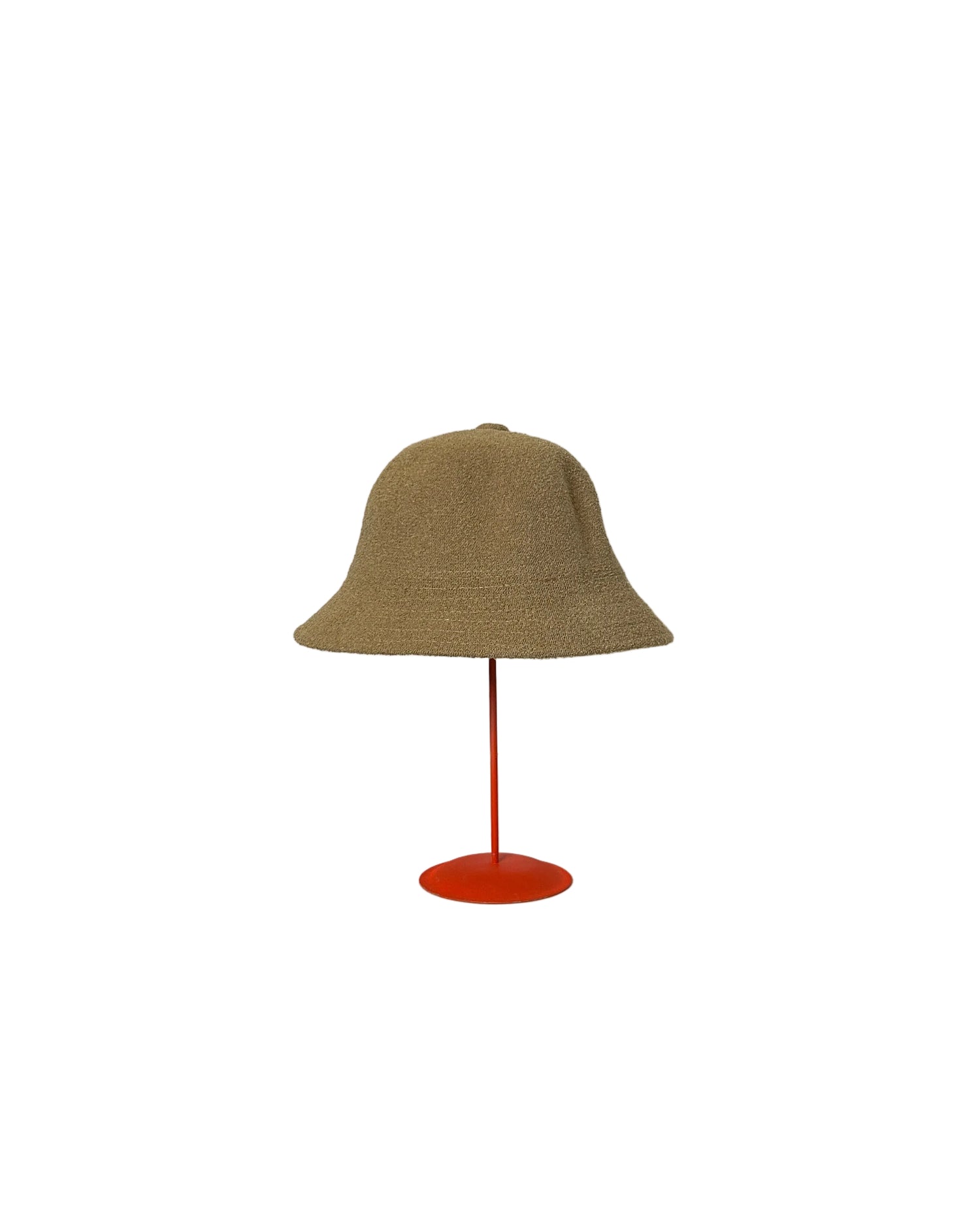 Beige Bucket hat on a red stand against a white backdrop. 