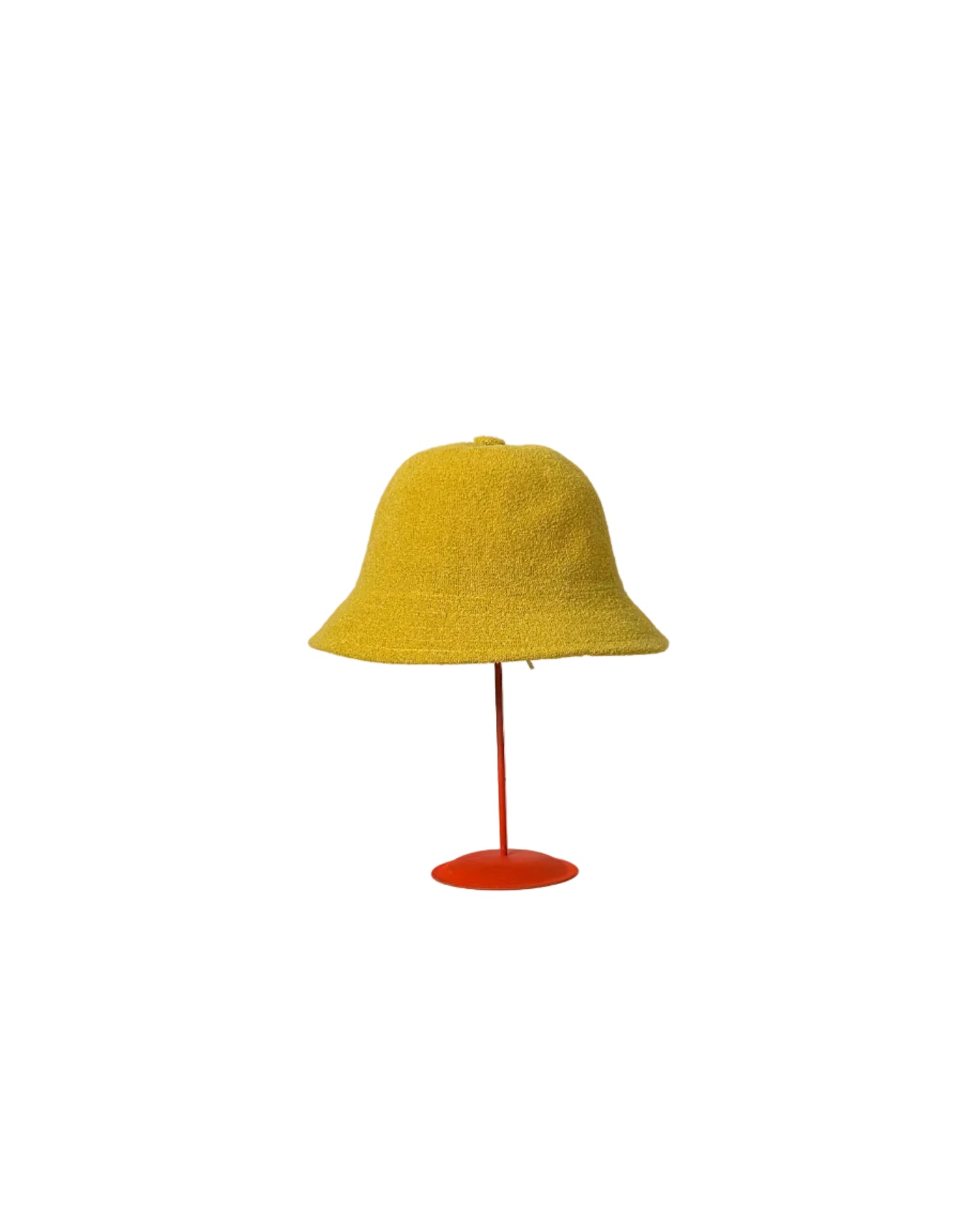 Yellow Bucket hat on a red stand against a white backdrop. 
