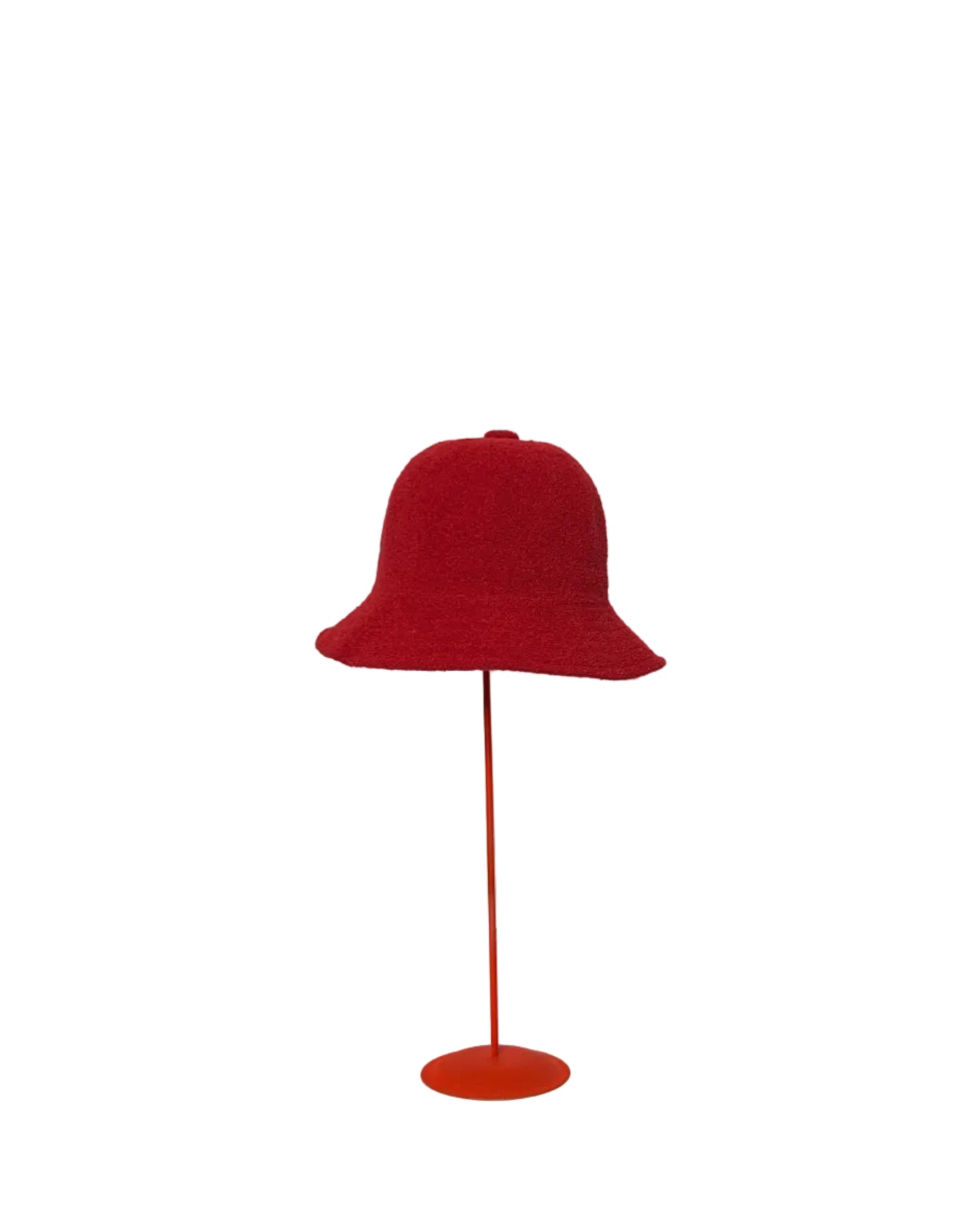 Red Bucket hat on a red stand against a white backdrop. 