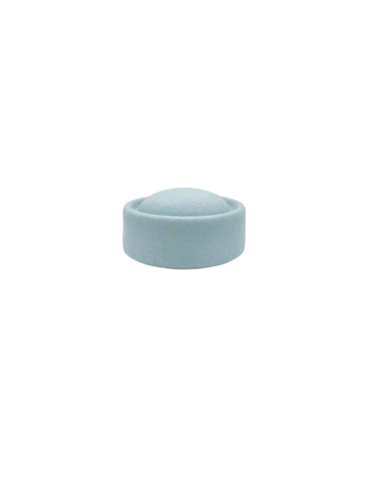Pale Blue Pillbox hat on a white background, wool hat, woolen hat, enhats, handmade, design, artisan, hat, hannasaren