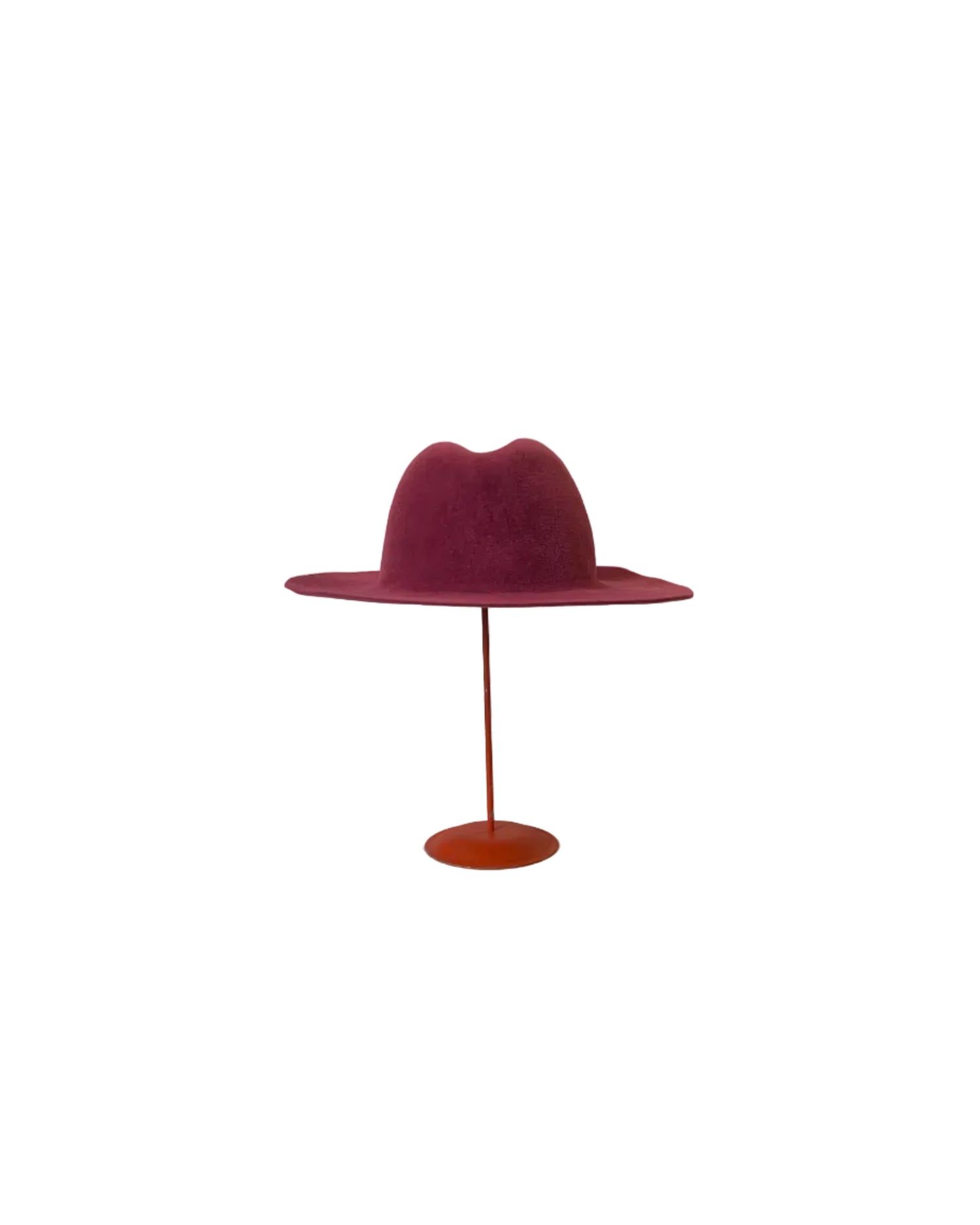 Pink Fedora hat on a stand against a white background